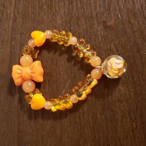 Home made bead bracelet: Orange gummy bear